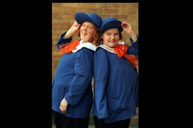 Pupils Rebecca Maddock and Gemma Muncaster dress up as Tweedle Dum and Tweedle dee for a Book week