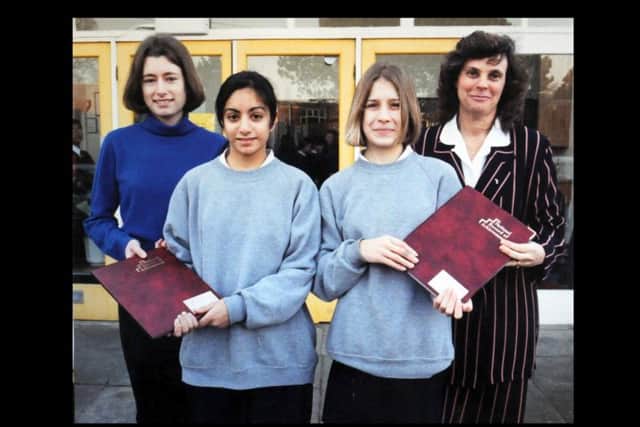 Presentation of achievement books, from left, special guest Sharon Woodruff, Rizwana Bangliwala, Rebecca Adair and Jen Farrington