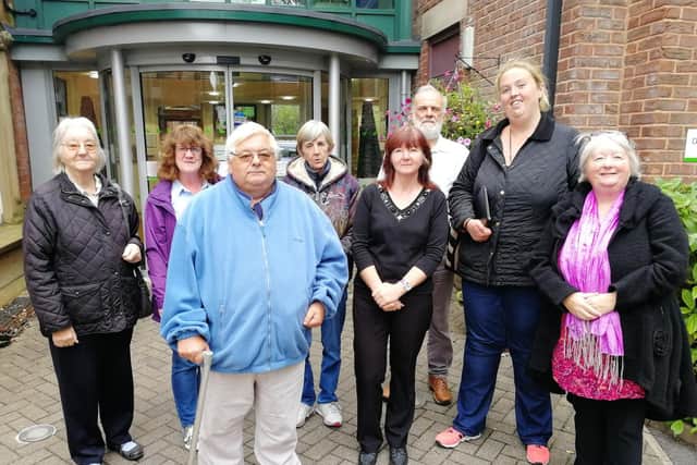 Campaigners celebrate after the meeting where Station Surgery's future was secured