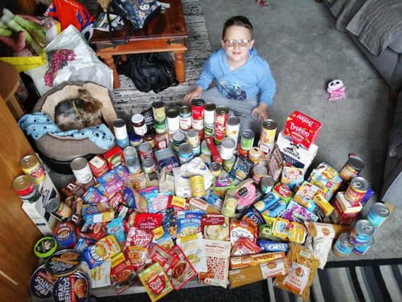 Joshua Blackwell (8), who attends Farington Moss St Paul's CE Primary School, filled sevenfull crates with hygiene products, non-perishable food and warm clothing. He spent nearly every day for six weeks collecting the items, whichwere donated to the Salvation Army in Preston.