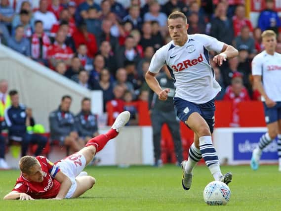 Preston's Billy Bodin leaves Nottingham Forest skipper Michael Dawson on the floor at the City Ground