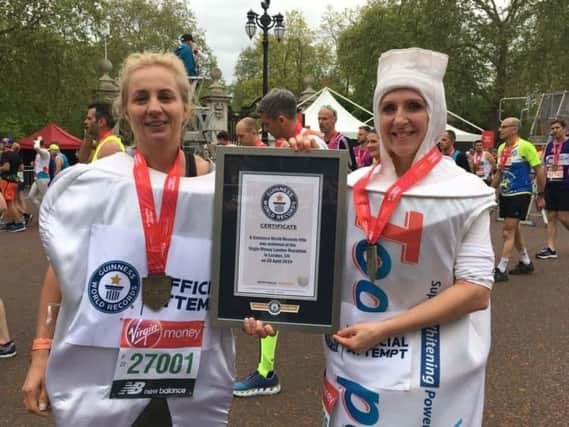 Fiona May Beaty and Katie Simpson ran the London Marathon dressed as a tooth and toothpaste