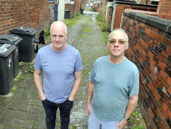 John Turner and David Yates, of Victoria Street in Lostock Hall, are fed up with their neighbourhood being used for fly-tipping.