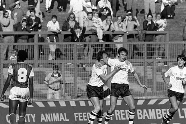 Wayne Foster is congratulated by John Thomas after scoring Preston's first goal against Chester in October 1985