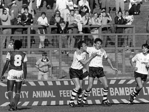 Wayne Foster is congratulated by John Thomas after scoring Preston's first goal against Chester in October 1985