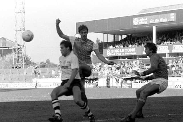 Preston striker Wayne Foster shields the ball from a Chester defender