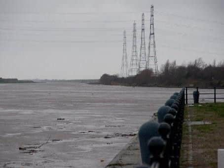 The Ribble in full flood with masses of debris rushing past. Pic: Roger Goodwin