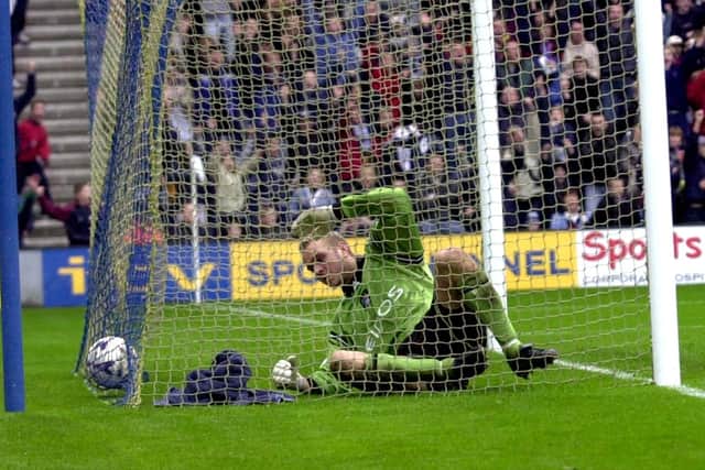 Manchesyer City goalkeeper Nicky Weaver ended up in the back of the net with the ball after being beaten by Jonathan Macken's shot