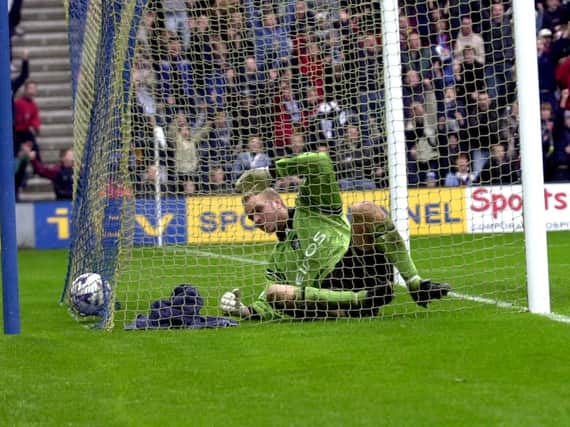 Manchesyer City goalkeeper Nicky Weaver ended up in the back of the net with the ball after being beaten by Jonathan Macken's shot