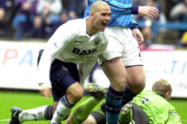 David Healy celebrates scoring Preston's equaliser against Manchester City
