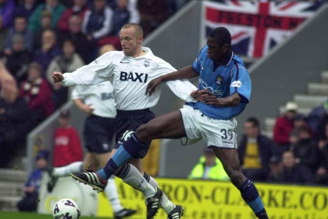 Paul McKenna takes on Manchester City midfielder Dickson Etuhu who would later join PNE