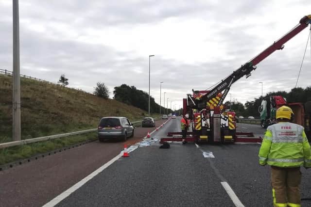 Trapped traffic has been released and is using the hard shoulder to pass the scene. The motorway will remain closed until the diesel on the carriageway is assessed and cleared