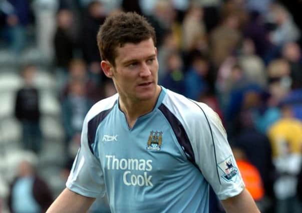 David Nugent wearing a Manchester City shirt following Preston's FA Cup defeat in February 2007