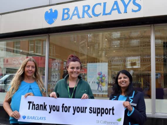 Emma Jacovelli from St Catherines Hospice with Barclays staff Shirley Murrell and Amita Nayee