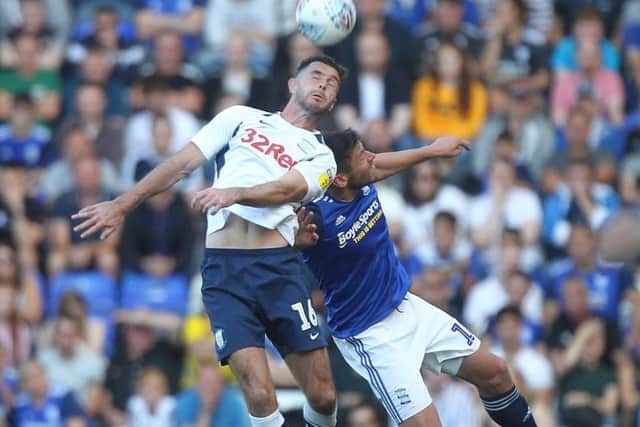 Andrew Hughes jumps with Lukas Jutkiewicz in Preston's win against Birmingham at St Andrew's