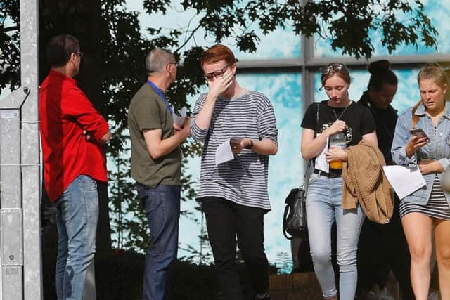 Workers leave the Thomas Cook Headquarters in Peterborough