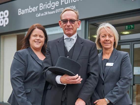 Funeral arrangers Martina Nicholson (left) and Jane Johnson are hosting a Macmillan Coffee Morning at  Bamber Bridge Coop Funeralcare. They are pictured with funeral director Steve Gregory.