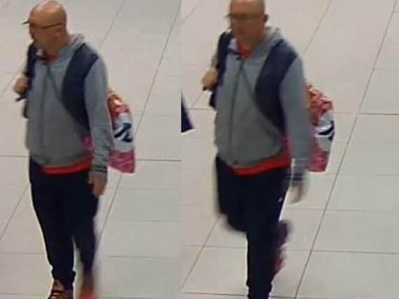 Ricky Stuart, 37, is pictured on CCTV at The Mall in Blackburn on Thursday at around 5.50pm