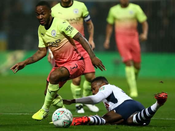 Raheem Sterling leaves Darnell Fisher on the floor in Preston's Carabao Cup defeat to Manchester City at Deepdale