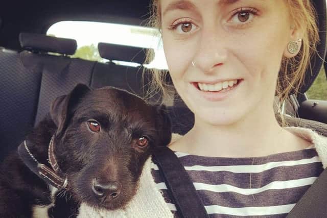 Beth with her dog Finn, who she says barks for her boyfriend Ben when she faints at home.
