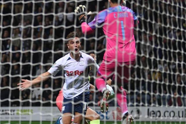 Preston midfielder Josh Harrop is inches away from connecting with an early cross against Manchester City
