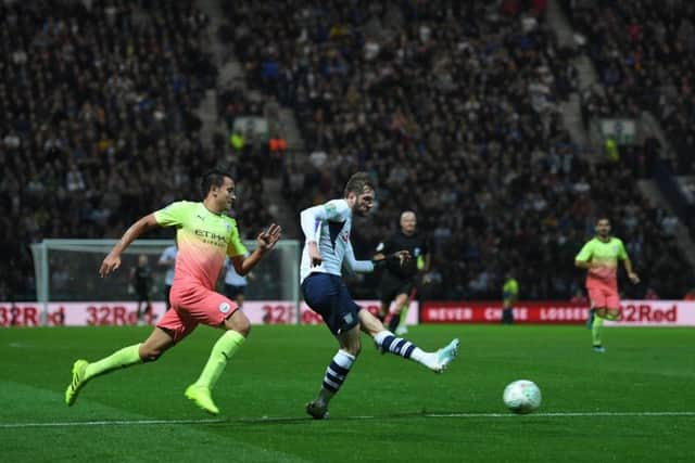 Tom Barkhuizen has a shot against Manchester City