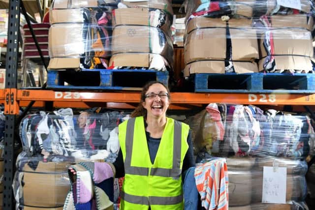 Julie Rowlandson of International Aid charity in Hoole sorting urgently needed clothing