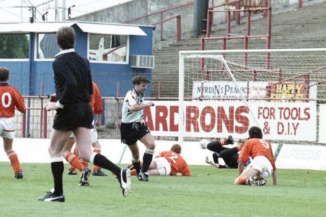 Tony Ellis' shot finds the back of the net as he completes his hat-trick against Blackpool