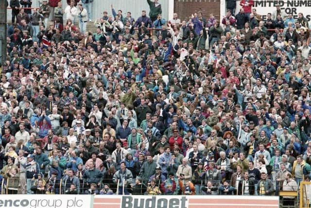 Preston supporters celebrate the 3-2 win against Blackpool at Bloomfield Road