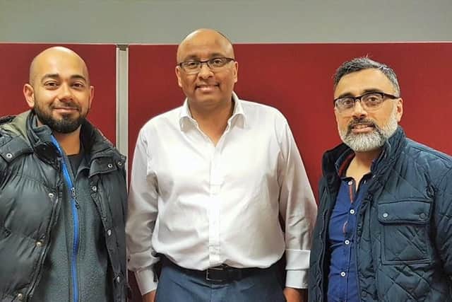 Noor Foodbank volunteers Mubeen Patel (left) and Suleman Adam (right) with Preston MP Mark Hendrick (centre)