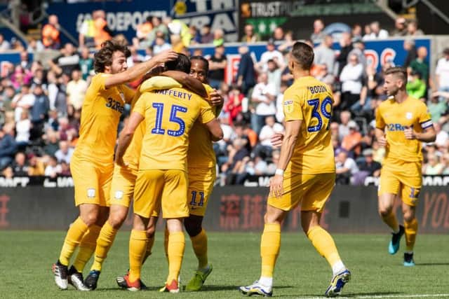 Joe Rafferty (No.15) is congratulated after scoring for Preston against Swansea in August