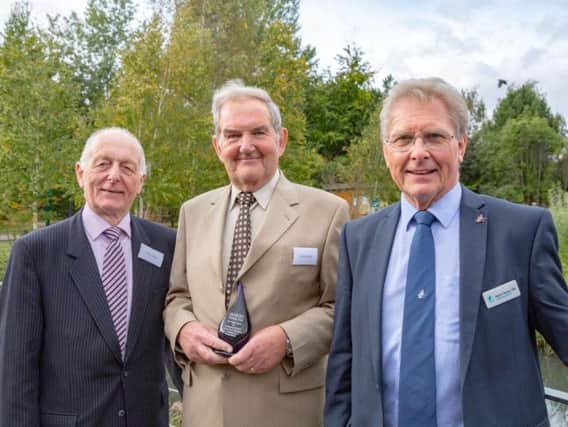 David Hindle receives his award from (l) Peter Titley, Marsh Christian Trust and (r) Martin Spray, CEO, WWT