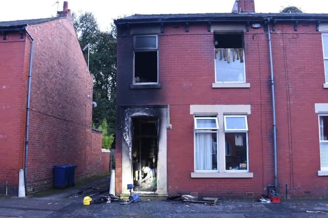 Firefighters are damping down after the blaze took hold of the ground floor entrance hall and first floor of a terraced house on Margaret Road.