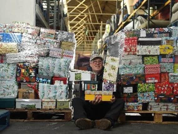 Paul Dufton, warehouse operator at International Aid Trust, getting ready for the Send a Smile shoebox appeal.