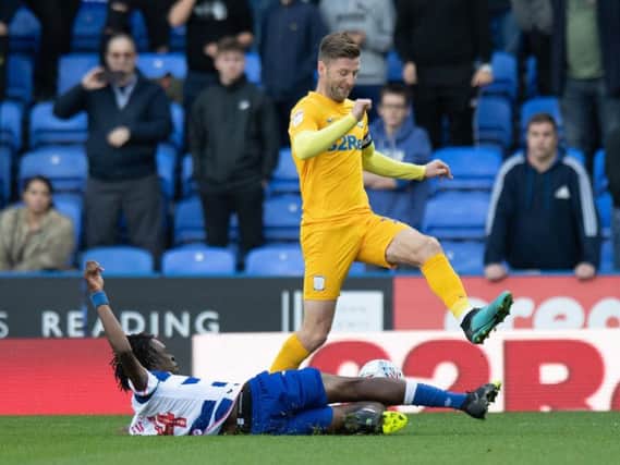 Paul Gallagher is tackled by Reading's Ovie Ejaria