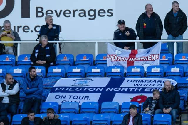 Some of the 1,012 PNE fans and their flags at Reading