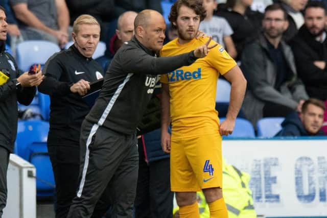 Alex Neil gives instructions to PNE midfielder Ben Pearson during the defeat at Reading