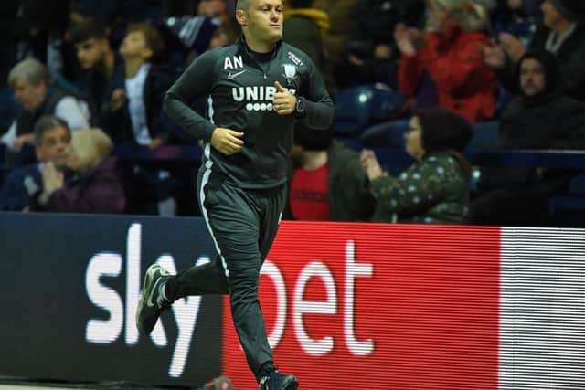PNE manager Alex Neil sprints to the dressing room at half-time against Leeds