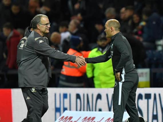 Marcelo Bielsa and Alex Neil shake hands on the touchline at Deepdale