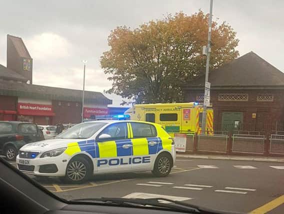 Police at the scene in Harpurhey after they responded to reports of a stabbing in a McDonalds. Pic- DamiLola B Soyoye via Twitter