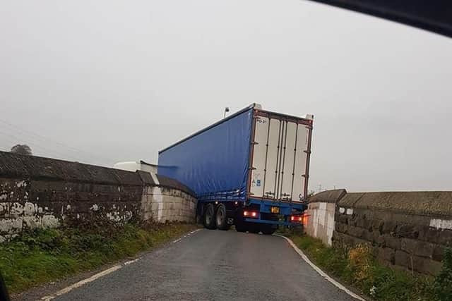 The lorry became stuck on a bridge over the railway line, near the A6 in Lancaster, at 7.40am this morning (October 24)