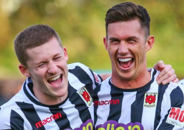 Matt Challoner and Mark Ross celebrate  after the  cup win over Spennymoor (photo: Stefan Willoughby)