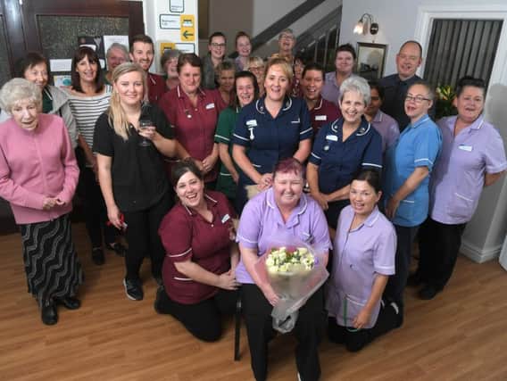 Debbie Hollinshead (front, centre) celebrating her 25-year anniversary of starting work at Longton Nursing and Residential Home