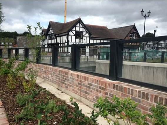 An example of a glass-panelled flood defence, being used in the Northwich Flood Risk Management Scheme.