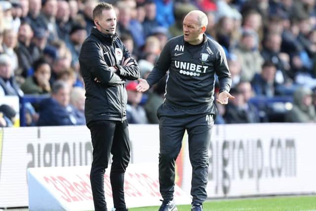 Preston manager Alex Neil with the fourth official at Deepdale
