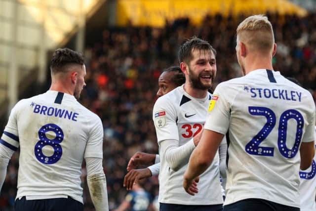 Tom Barkhuizen with Jayden Stockley and Alan Browne after scoring the winner in Preston's victory against Blackburn