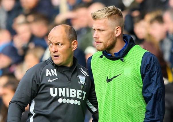 Jayden Stockley gets instructions from PNE boss Alex Neil before coming on as sub against Blackburn