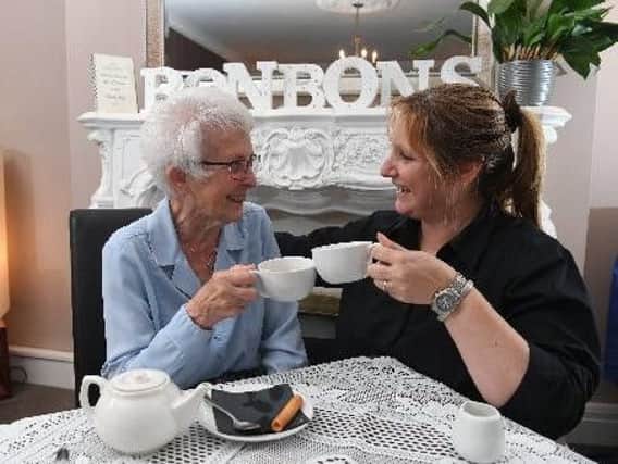 Kathleen Brocklehurst (left) attends a friendship group run by Sylvia Richmond at Bon Bons Coffee Bar in Penwortham.
