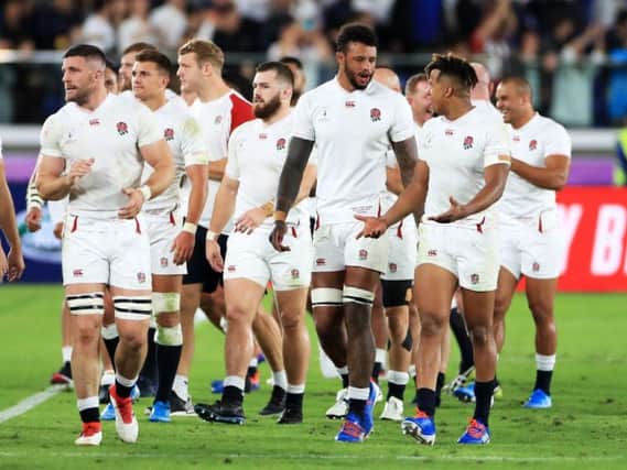 England's Courtney Lawes (centre), Anthony Watson (right) and team-mates walk off after the 2019 Rugby World Cup Semi Final match at International Stadium Yokohama. Photo: Adam Davy/PA Wire.