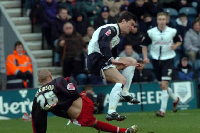 David Nugent rides a tackle against Stoke